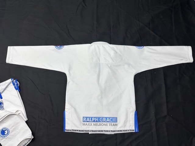 White BJJ gi flat-lay from the Special Sporting factory