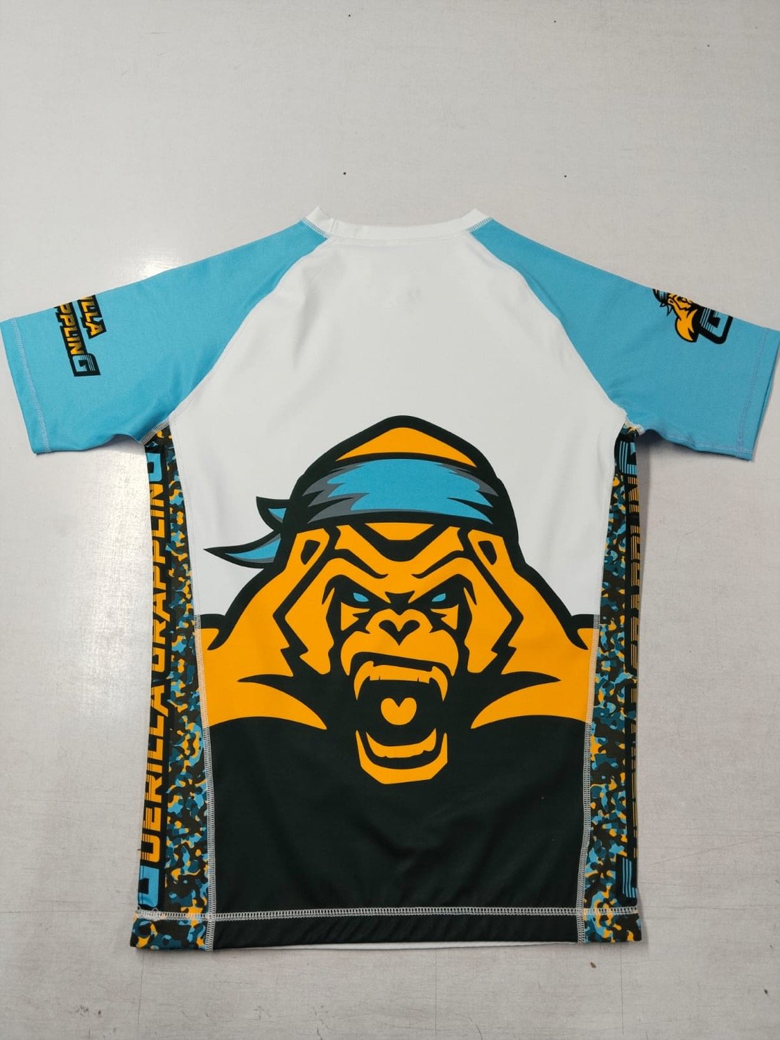 Full-sublimation no-gi BJJ rashguard with edge-to-edge custom gorilla print, made by Special Sporting
